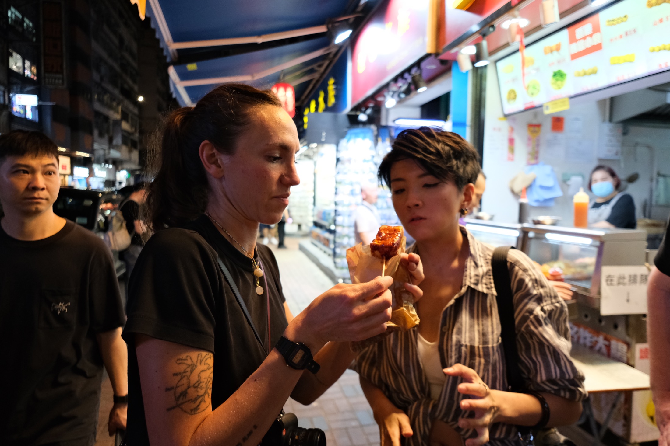 Guests tasting street food in Hong Kong